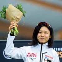 Miho Takagi celebrates after winning the women\'s 10,000-meter race at the ISU World Sprint and Allround Speed Skating Championships on Friday in Hamar, Norway. | REUTERS