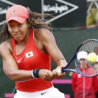 Naomi Osaka hits a backhand return to Spain\'s Sara Sorribes Tormo in a Fed Cup tie on Friday in Murcia, Spain. | KYODO