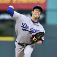 Right-hander Kenta Maeda spent the past four seasons with the Dodgers. He was officially traded to the Twins on Monday. | KYODO