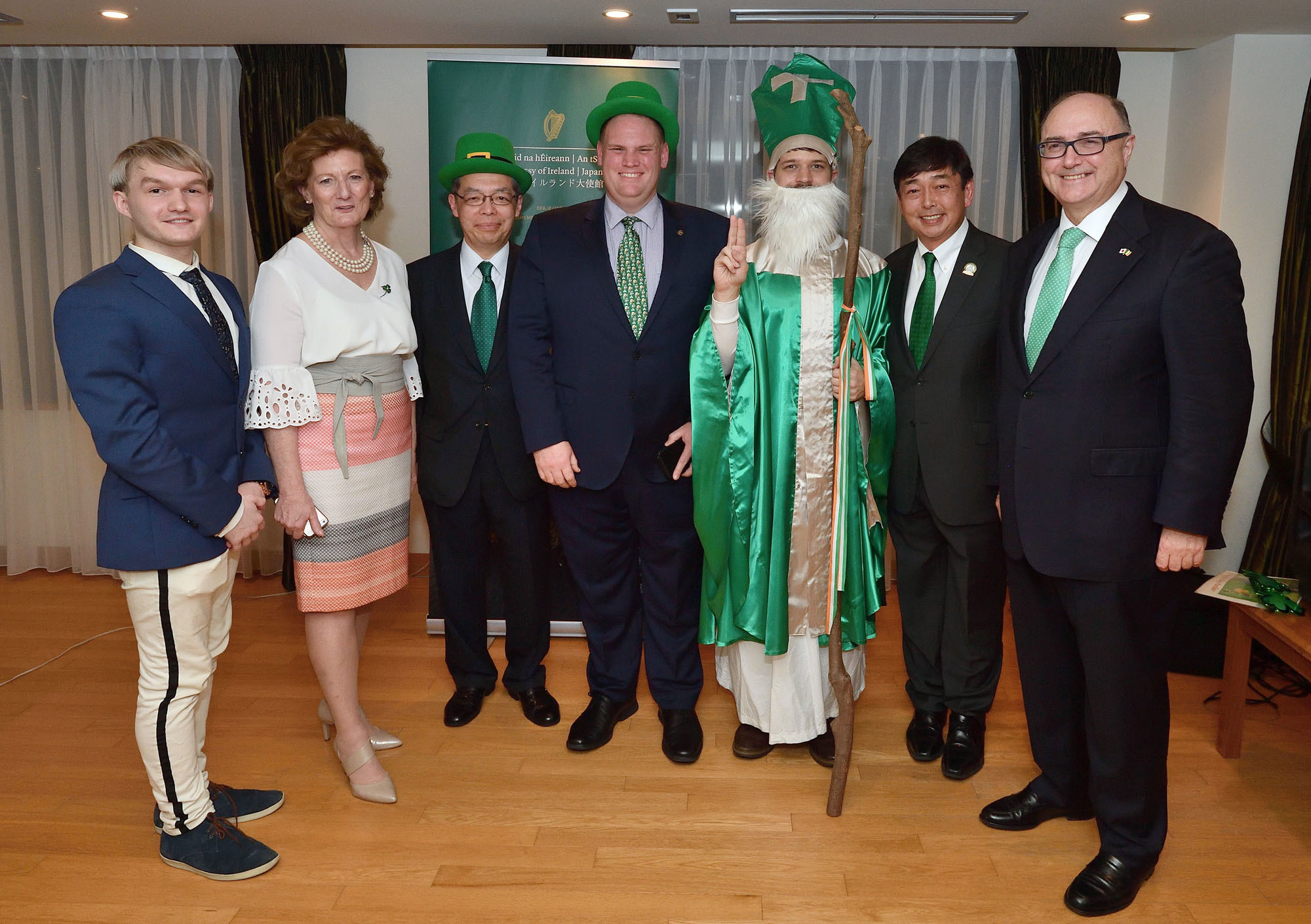 Irish Ambassador Paul Kavanagh (right) poses with, from left, TV personality Eugene Musinski; Rosemary, Kavanagh's wife; Yoshihiro Tsuchiya, acting president of the Ireland-Japan Chamber of Commerce; Emmett Bowen, chairman of Irish Network Japan; Matthew Corbally dressed as St. Patrick; and Hideki Mimura of the St. Patrick's Day Celebration Japan Committee, during the St. Patrick's Day in Japan Showcase at the ambassador's residence in Tokyo on Feb.14 | YOSHIAKI MIURA