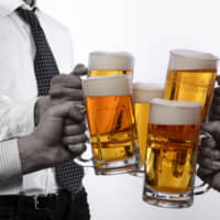Table talk: Young Japanese appear to be less interested in mixing with their colleagues over drinks after work. | GETTY IMAGES