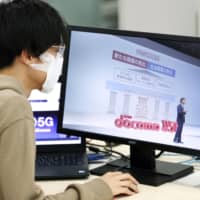 NTT Docomo Inc. President Kazuhiro Yoshizawa holds an online news conference Wednesday in Tokyo to announce the launch of smartphone services based on superfast 5G technology on March 25. The news conference went online out of concern over the spread of the new coronavirus. | KYODO