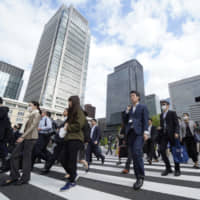 The coronavirus outbreak caused almost half of Japanese firms to see their output and sales slide last month, according to a recent poll. | BLOOMBERG