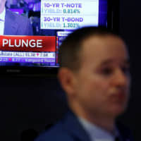 A screen broadcasts stock market news on the floor of the New York Stock Exchange on Wednesday. | REUTERS
