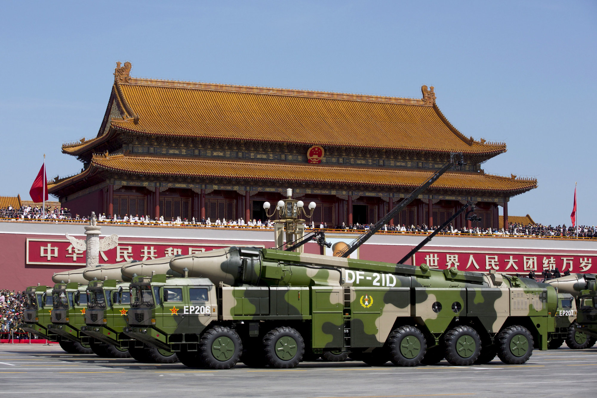 Chinese military vehicles carrying DF-21D anti-ship ballistic missiles travel past Tiananmen Gate during a military parade to commemorate the 70th anniversary of the end of World War II in Beijing in September 2015. | POOL / VIA REUTERS