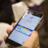 The QR-based health code system by Alipay from Ant Financial assigns each user one of three colors &#8212; green, yellow or red &#8212; based on their location, basic health information and travel history. Green allows freedom of movement, while yellow and red indicate that you need to self-quarantine or enter a supervised quarantine facility, respectively. | BLOOMBERG
