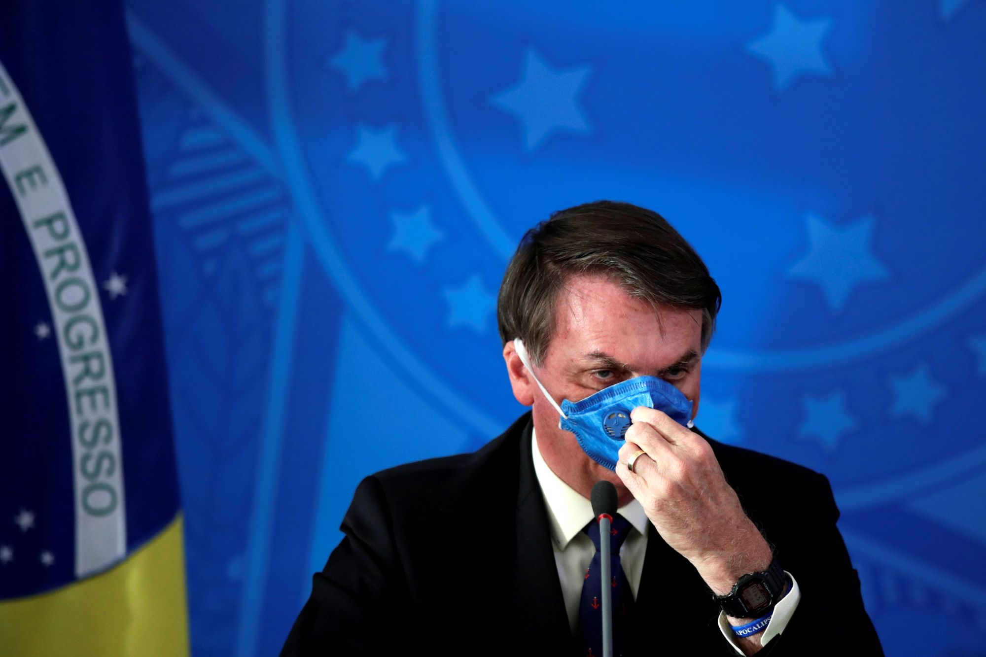 President Jair Bolsonaro makes a statement on Brazil's COVID-19 outbreak in Brasilia on Friday. | REUTERS