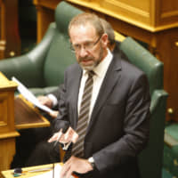 New Zealand Justice Minister Andrew Little speaks to lawmakers in Wellington on Wednesday. | AP