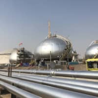 Saudi Aramco\'s crude oil processing facility in Abqaiq | BLOOMBERG