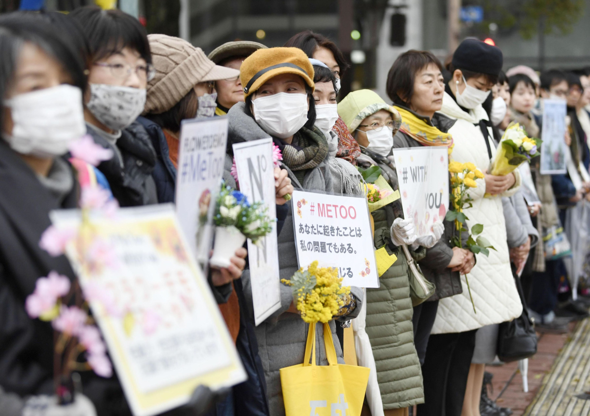 Protesters attend a gathering of the Flower Demo movement against sexual violence in Nagoya on Sunday, International Women's Day. The nationwide movement was triggered by outrage over district court acquittals in several sexual assault cases in March 2019. | KYODO