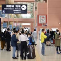 The international arrival lobby at Kansai International Airport in Osaka Prefecture is crowded with travelers and their family members on Saturday. | KYODO