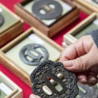 En garde: Most of these sword guards, each kept in its own wooden box and sold at the Oedo Antique Market by Kensuke Tansho, were crafted during the Edo Period (1603-1868).