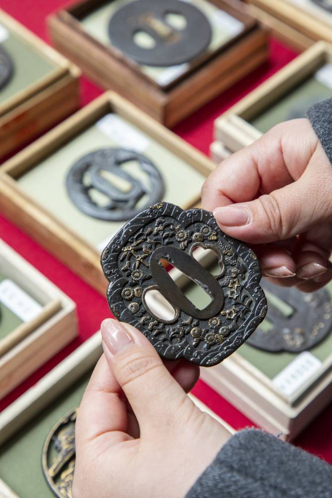 En garde: Most of these sword guards, each kept in its own wooden box and sold at the Oedo Antique Market by Kensuke Tansho, were crafted during the Edo Period (1603-1868).