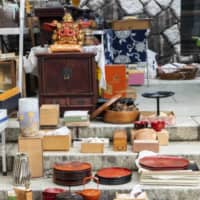 On the steps: Atsuko Kokune, who runs three antique markets including Gozare-ichi, always displays her wares next to the five-storied pagoda at Takahata Fudoson Kongoji temple.