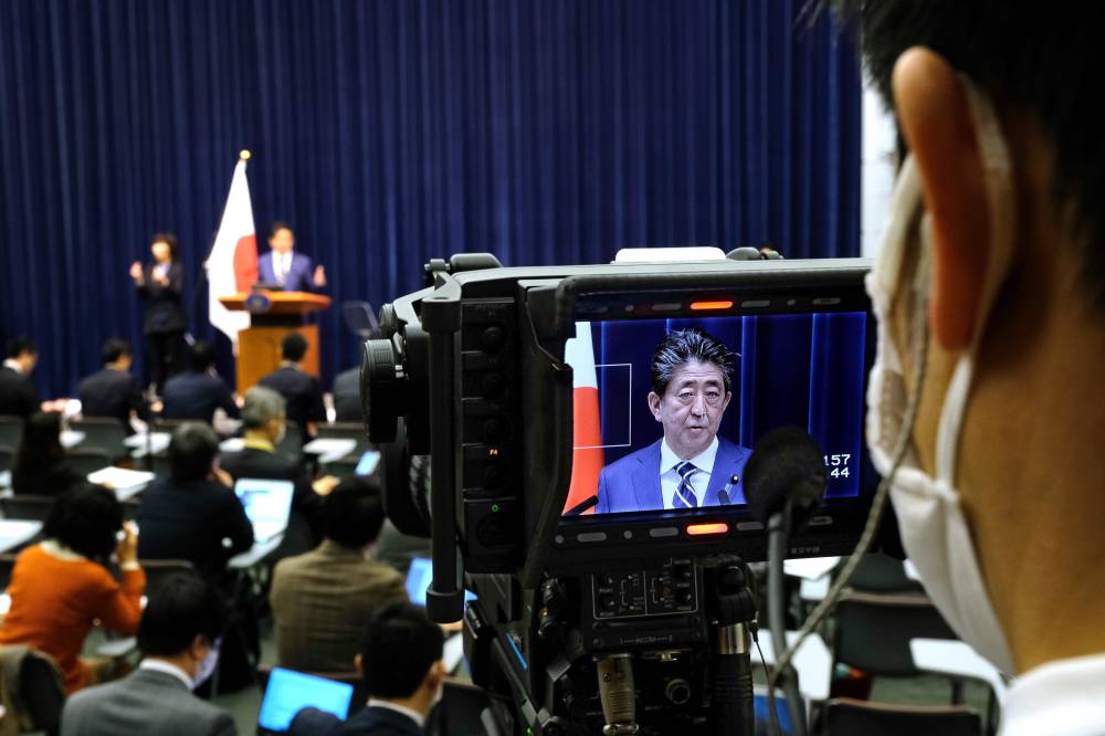 A camera captures Prime Minister Shinzo Abe speaking at a news conference in Tokyo on Saturday. | AFP-JIJI