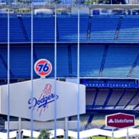 Los Angeles\' Dodger Stadium sits empty on Thursday, when it was scheduled to host the opening day game between the Dodgers and Giants. | USA TODAY / VIA REUTERS