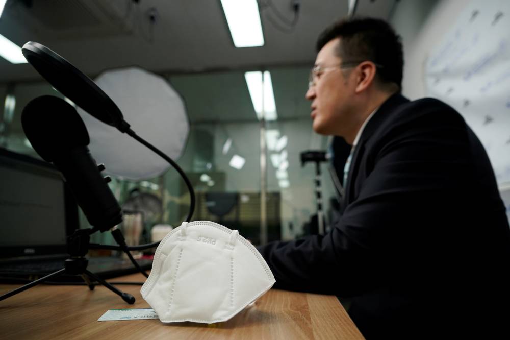 A professor who used to be a coronavirus patient gives an online lecture at Pusan National University in Busan, South Korea. | REUTERS