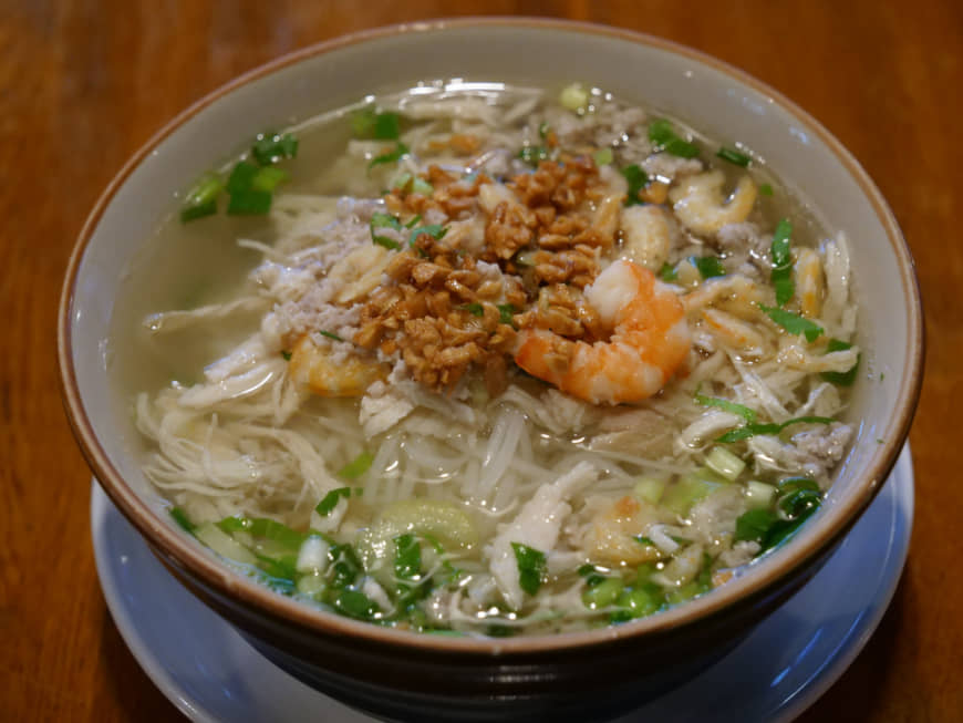 Consistently delicious: Angkor Wat's popular pho noodles are made with a mixed pork-and-chicken broth, topped with fried garlic and shrimp. | CHISATO TANAKA