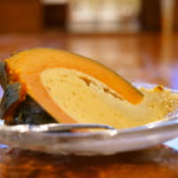 Signature dish: This traditional Cambodian dessert is made by hollowing out an entire pumpkin and filling it with egg, coconut milk and sugar before steaming it for several hours. | CHISATO TANAKA
