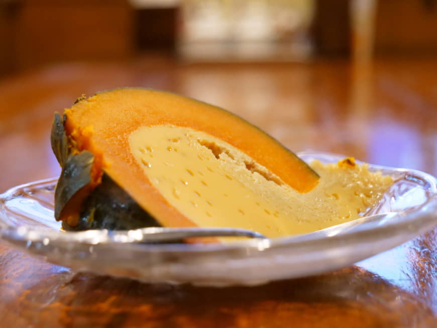 Signature dish: This traditional Cambodian dessert is made by hollowing out an entire pumpkin and filling it with egg, coconut milk and sugar before steaming it for several hours. | CHISATO TANAKA