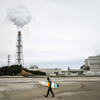Emissions are released from a coal-fired power station in Minamisoma, Fukushima Prefecture, on March 4. Coal currently provides some 30 percent of the nation\'s power supply. | AFP-JIJI
