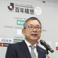 J. League Chairman Mitsuru Murai speaks at a news conference in February. | KYODO