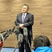 Japanese Olympic Committee President Yasuhiro Yamashita holds a news conference on Monday in Tokyo. | KAZ NAGATSUKA