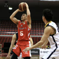 Shigehiro Taguchi of the Chiba Jets Funabashi takes a jump shot against the Utsunomiya Brex at Funabashi Arena on March 14. Taguchi is the president of the Japan Basketball Players Association. | KAZ NAGATSUKA