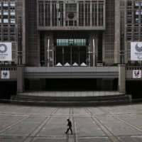 A man walks in front of the Tokyo Metropolitan Government building on Feb. 25. | AP