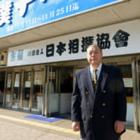 Former komusubi Oshio stands outside Fukuoka Kokusai Center on Nov. 26, 2012. | KYODO