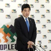 Top League chairman Osamu Ota announces the league\'s decision to call off the rest of its March fixture schedule at a Monday news conference in Minato Ward. | KYODO