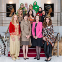 Japan\'s first lady Akie Abe (front row, second from left) and spouse of the minister for foreign affairs Emi Motegi (front row, second from right) pose for a group photo with President of  the Society of Arab Ambassadors and Heads of Missions in Japan (SWAAJ) and spouse of the Algerian ambassador Amira Bencherif (front row, left); SWAAJ Vice President and spouse of the Egyptian ambassador Ghada Kamel (front row, right); and other members at a luncheon hosted by SWAAJ at the Egyptian ambassador\'s residence on Feb. 13. Other members include representatives from Lebanon, Palestine, Bahrain, Mauritania, Tunisia, Kuwait, Oman and Sudan. | MIKI OSHITA