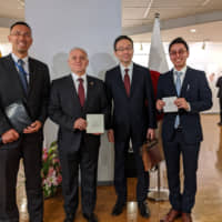From Left: Norifumi Kondo, director of the South America Division of the Latin American and the Caribbean Affairs Bureau, Ministry of Foreign Affairs; Jaime Barberis, ambassador of Ecuador to Japan; Yuji Sudo, ambassador of Japan to Ecuador; and Kotaro Ezawa, CEO of Mamano Chocolate Inc., at an opening ceremony of \"The Fine Aroma of Our Identity\" exhibition hosted by the Ecuadorian Embassy and Mamano Chocolate, at the Takanawa Civic Center Gallery in Tokyo on Feb.25. Attendees enjoyed Mamano Chocolate\'s high-percentage cacao chocolate made with high-quality Ecuadorian fine aroma cocoa. | PHOTO COURTESY OF THE ECUADORIAN EMBASSY