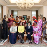 The Association of Wives of African Ambassadors in Japan (AWAAJ) hosted a luncheon at the Algerian ambassador\'s residence on Feb. 25. Front row from right: Nantenin Sylla, president of AWAAJ and spouse of the ambassador of Guinea; Akie Abe, first lady of Japan; Emi Motegi, spouse of the minister for foreign affairs; and Amira Bencherif, vice president and spouse of the ambassador of Algeria. Other members (back row from right) include representatives from Ethiopia, Angola, Tunisia, Benin, Malawi, Cote d\'Ivoire, Cameroon, Burkina Faso, Senegal and Mauritania. | MIKI OSHITA