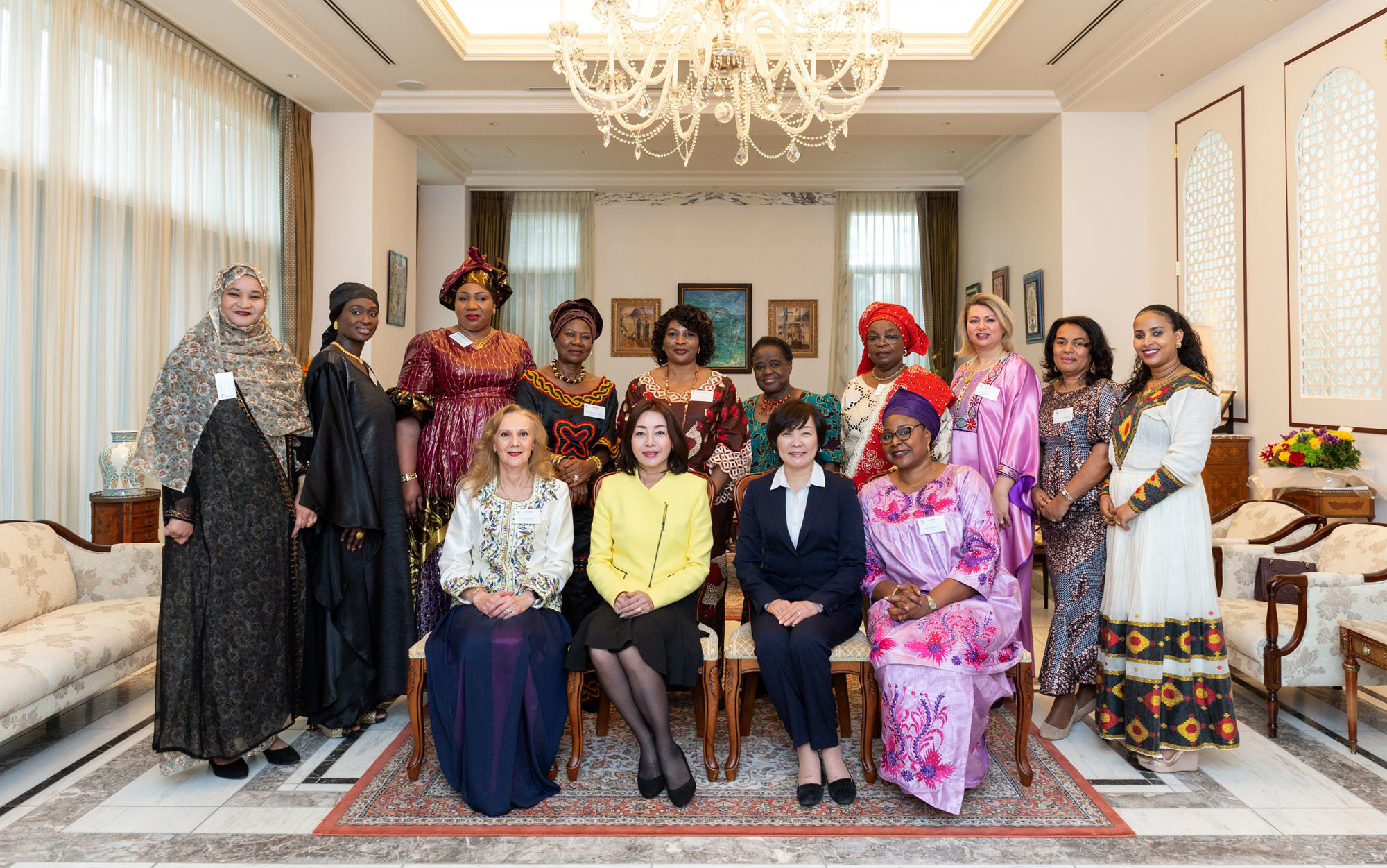 The Association of Wives of African Ambassadors in Japan (AWAAJ) hosted a luncheon at the Algerian ambassador's residence on Feb. 25. Front row from right: Nantenin Sylla, president of AWAAJ and spouse of the ambassador of Guinea; Akie Abe, first lady of Japan; Emi Motegi, spouse of the minister for foreign affairs; and Amira Bencherif, vice president and spouse of the ambassador of Algeria. Other members (back row from right) include representatives from Ethiopia, Angola, Tunisia, Benin, Malawi, Cote d'Ivoire, Cameroon, Burkina Faso, Senegal and Mauritania. | MIKI OSHITA
