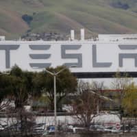 Tesla Inc.\'s U.S. vehicle factory remains open in Fremont, California, on March 18 despite an order by the Alameda county\'s sheriff\'s office to comply with a three-week lockdown in the San Francisco Bay Area, in order to rein in the spread of COVID-19. | REUTERS