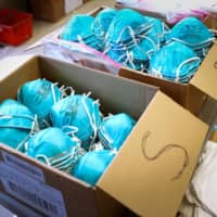 Boxes of N95 masks for use by medical field personnel are lined up a New York emergency operations incident command center in New Rochelle, New York, on March 17.  | REUTERS
