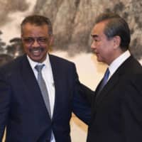 WHO Director General Tedros Adhanom attends a meeting with Chinese Foreign Minister Wang Yi in Beijing on Jan. 28 | SYUYA AOKI
