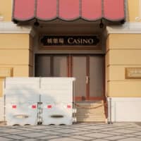 Barriers block a closed entrance to the Wynn Macau casino resort on March 24. | REUTERS