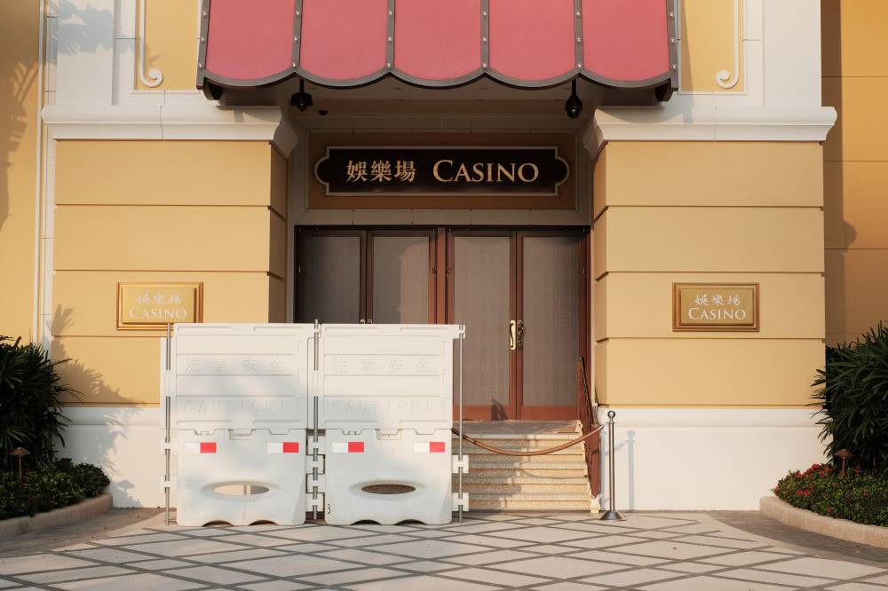 Barriers block a closed entrance to the Wynn Macau casino resort on March 24. | REUTERS