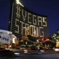 Hotel room lights spell out \"Vegas Strong\" on Wednesday at the Wynn hotel-casino along the Las Vegas Strip as casinos and other business are shuttered due to the coronavirus outbreak. | AP