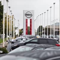 Nissan Motor Co. car dealership in Joliet, Illinois. Nissan said it will extend its factory suspensions in the United States through late April to help reduce the spread of the new coronavirus and protect employees. | BLOOMBERG