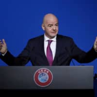 FIFA President Gianni Infantino addresses the UEFA Congress on March 3 in Amsterdam. | REUTERS