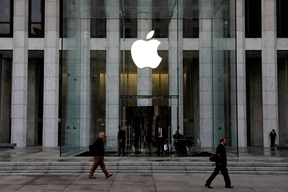 The Apple Inc. logo at the entrance to the Apple store on 5th Avenue in Manhattan, New York, in October 2019 | REUTERS