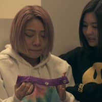 Crime of fashion: Hana (left) cries over her ruined wrestling outfit on \"Terrace House Tokyo 2019-2020.\" | © FUJI TELEVISION / EAST ENTERTAINMENT
