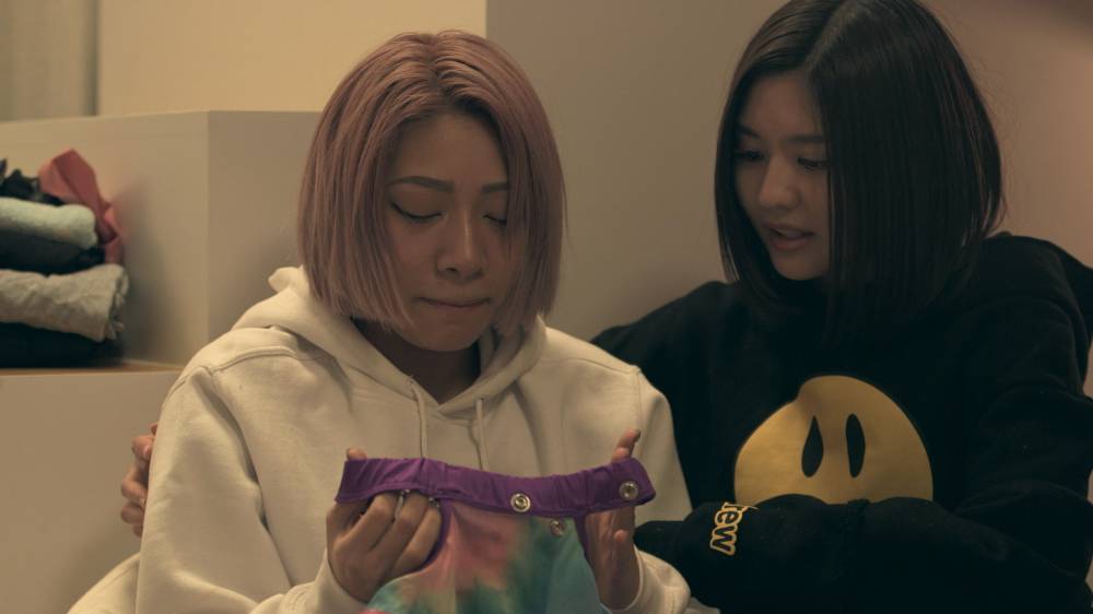 Crime of fashion: Hana (left) cries over her ruined wrestling outfit on 'Terrace House Tokyo 2019-2020.' | © FUJI TELEVISION / EAST ENTERTAINMENT