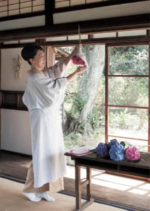 Petal prayers: Hirota hangs a hydrangea talisman from a beam near a doorway in her home. She does this every year during the rainy season to express her prayers for the good health of her family. | SHOGO OIZUMI 