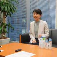 Kuniko Okuno, group leader of Rohto Pharmaceutical Co.’s product marketing division, talks about the components and packaging of the Hada Labo skin care series. | AFP-JIJI