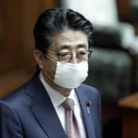 Prime Minister Shinzo Abe speaks during a plenary session at the upper house of parliament in Tokyo on Friday. | USA TODAY SPORTS /VIA REUTERS
