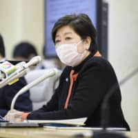 Tokyo Gov. Yuriko Koike speaks at a news conference in Tokyo on Monday night. | KYODO